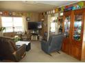 Comfortable living room with a large TV and cozy seating at 18800 Sw 31St St, Dunnellon, FL 34432