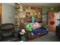 Cozy living room with a brick fireplace and unique wall decor at 18800 Sw 31St St, Dunnellon, FL 34432