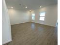 Bright living room with recessed lighting and wood-look tile floors at 3969 Ne 30Th Ter, Ocala, FL 34479