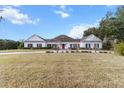 Spacious home with a well-manicured lawn and mature trees offers a peaceful and inviting setting at 4620 Nw 84Th Ter, Ocala, FL 34482