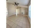 Open living room featuring tile floors and a ceiling fan at 3940 Sw 138Th Pl, Ocala, FL 34473