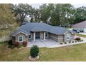 Inviting one-story home boasting a well-kept lawn and decorative landscaping, enhancing curb appeal at 4604 Se 33Rd Pl, Ocala, FL 34480