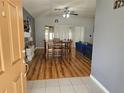 Open concept living room with hardwood floors and a dining area perfect for entertaining at 5155 Sw 39Th St, Ocala, FL 34474