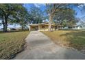 Quaint single story home with covered parking and a concrete driveway at 8973 Sw 104Th Ln, Ocala, FL 34481