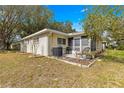 Cozy screened in patio with seating area, perfect for outdoor relaxation at 9691 Sw 95Th Ct # D, Ocala, FL 34481