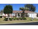 Charming single-story home features well-manicured landscaping and red shutters at 11353 Sw 138Th Ln, Dunnellon, FL 34432