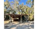 Exterior shot of outbuilding that is attached to the car port at 9205 Sw 152Nd Pl, Dunnellon, FL 34432