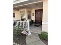 Cozy front porch with decorative plants, leading to a welcoming front door and covered entry at 9638 Sw 94Th Ct # A, Ocala, FL 34481