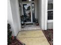 Inviting entryway featuring a tiled floor and decorative plants at 11221 Sw 71St Ct, Ocala, FL 34476