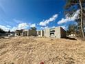 Partially built block home displays the early phases, set on a sandy lot under clear, blue skies at 15864 Se 98Th Ter, Summerfield, FL 34491