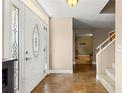 Inviting foyer with tile flooring, a decorative front door, and a view of the staircase at 2840 Se 35Th St, Ocala, FL 34471