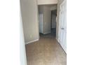 Entry foyer with tile flooring and a view of the carpeted interior at 4525 Sw 52Nd Cir # 105, Ocala, FL 34474