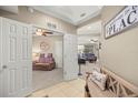 Spacious foyer showcasing neutral paint, tile and carpet flooring, and bright entryway to living spaces at 4555 Sw 52Nd Cir # 103, Ocala, FL 34474