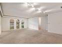 Bright and airy living room with large windows and neutral carpeting at 711 Se 26Th St, Ocala, FL 34471