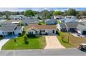 This aerial view showcases a well-maintained home in a quiet residential neighborhood at 912 Chula Ct, Lady Lake, FL 32159