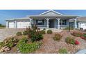 Charming single-story home featuring a well-manicured lawn and inviting front porch at 8107 Sw 92Nd Cir, Ocala, FL 34481
