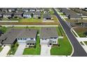 Aerial view of two homes showing their manicured lawns and proximity within the community at 8953 Sw 50Th Ter, Ocala, FL 34476