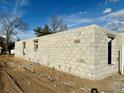 Side view of a house under construction showing a concrete block exterior at 9361 Se 162Nd Pl, Summerfield, FL 34491