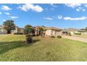 Charming single-story home featuring a well-manicured lawn and two-car garage at 1029 Sw 157Th Ln, Ocala, FL 34473