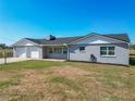 Appealing single-story home with an attached garage, freshly painted exterior, and neat front lawn at 13800 Se 80Th Ave, Summerfield, FL 34491