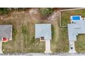 Aerial shot showcases the home's well-maintained yard and proximity to a sparkling pool at 1482 Ne 160Th Pl, Citra, FL 32113