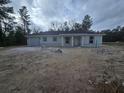 Inviting one-story home with attached garage and a covered front entry at 19 Bay Court Pass, Ocklawaha, FL 32179