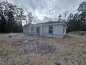 Side view of a cozy single-Gathering home with a fresh exterior at 19 Bay Court Pass, Ocklawaha, FL 32179