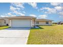 Attractive single-Gathering home with a well-maintained lawn and attached two-car garage at 434 Bar Ct, Kissimmee, FL 34759