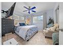 Comfortable bedroom with light blue walls and a soft rug, creating a serene atmosphere at 4445 Sw Azalea Ct, Dunnellon, FL 34431