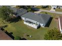 Aerial view of home featuring a backyard patio with white privacy fence at 6196 Sw 84Th Place Rd, Ocala, FL 34476