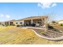 Expansive backyard with a screened lanai, offering an ideal space for outdoor living and entertaining at 8874 Sw 104Th Cir, Ocala, FL 34481