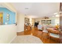 Open living room featuring wood floors, neutral paint, and an open floor plan at 9126 Sw 102Nd Cir, Ocala, FL 34481