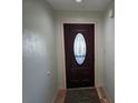 A straight on view of the front door leading to the interior foyer of the home at 10831 Se 50Th Ter, Belleview, FL 34420