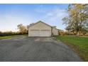 Spacious two car garage with concrete driveway and stone details at 6890 Nw 21St St, Ocala, FL 34482