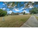 Expansive backyard with lush grass, bordered by a fence, offering a private outdoor space at 7151 Sw 96Th Ct, Ocala, FL 34481