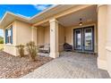 Inviting covered front porch with seating area, perfect for relaxing and enjoying the neighborhood at 9085 Sw 89Th Loop, Ocala, FL 34481