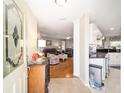 Bright entryway with a view into the living room and kitchen showcases the open floor plan at 9983 Sw 90Th Loop, Ocala, FL 34481