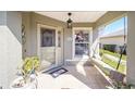 Inviting front porch with swing and decorative touches offering a relaxing welcome to the home at 9983 Sw 90Th Loop, Ocala, FL 34481