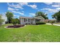 Charming single-story home with well-manicured front lawn and landscape at 10821 Sw 87Th Ter, Ocala, FL 34481