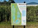 Welcome sign with a map of Ocala Wetland Recharge Park, displaying trail systems and recreational areas at 2150 Nw 23Rd Loop, Ocala, FL 34475