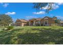 Beautifully landscaped front yard with a well-kept lawn and attractive curb appeal at 2301 Se 24Th Ave, Ocala, FL 34471