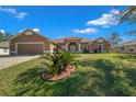 Well-maintained single-Gathering home featuring a lovely front yard and a two-car garage at 2301 Se 24Th Ave, Ocala, FL 34471