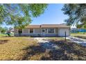 Charming one-story home features a well-kept lawn, inviting entrance, and attached one car garage at 328 Oak Track Run, Ocala, FL 34472