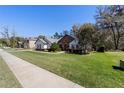 Beautifully landscaped front yard of this home with a stone facade and well-maintained lawn at 4103 Se 10Th Ave, Ocala, FL 34480