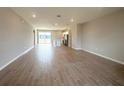 Open-concept living room with recessed lighting and wood-style flooring throughout the home at 4524 Sw 110Th St, Ocala, FL 34476