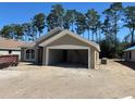 A lovely single Gathering home with a 2-car garage awaits landscaping at 7649 Sw 180Th Cir, Dunnellon, FL 34432