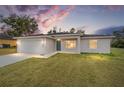 Newly built single Gathering home with an attached garage and a well-manicured front lawn at 22 Juniper Drive Crse, Ocala, FL 34480