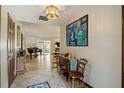 Inviting foyer with tile floors and natural light highlighting the artwork and open floorplan at 4420 Ne 1St St, Ocala, FL 34470
