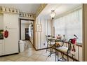 Cozy kitchen nook features a charming breakfast table and bright natural light from the window at 4420 Ne 1St St, Ocala, FL 34470