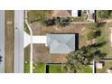 Birds eye view of the home. Showing the roof, the driveway, the street, and the lawn at 509 Marion Oaks Trail, Ocala, FL 34473